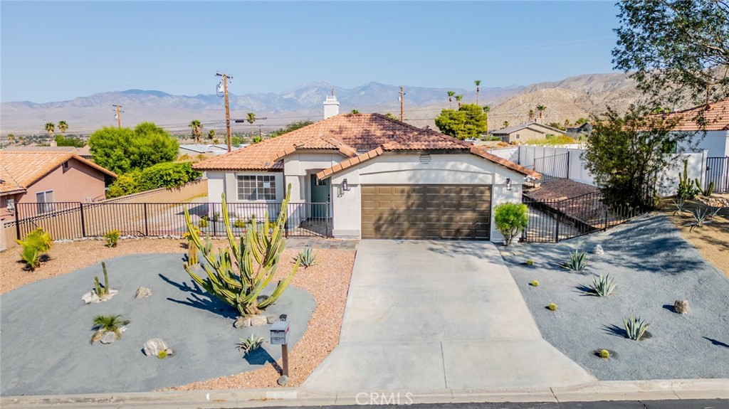 Welcome to your perfect One story home in the city of Desert Hot Springs with an amazing floor plan and upgrades! Perfect blend of style and comfort, this home is ready to create lasting memories. three spacious bedrooms and two bathrooms, all situated on a generous 7,405 sq. ft. lot. The family room has a cozy fireplace with NEW Tile surround with natural lighting creating a warm and inviting atmosphere. Few of the upgrades include, New carpet in the bedrooms. Freshly painted interior and exterior. Kitchen updated with New quartz countertops, a stylish tile backsplash, and all-new stainless steel appliances, sink and fixtures.. Enjoy the spacious front and backyard—perfect for relaxing, entertaining, or hosting family barbecues. The home also features an attached two-car garage for added convenience.The home also features an attached two-car garage for added convenience.. Located in a desirable neighborhood with easy access to shopping centers and major freeways, this home truly has it all... Don't wait, schedule your showing today!
