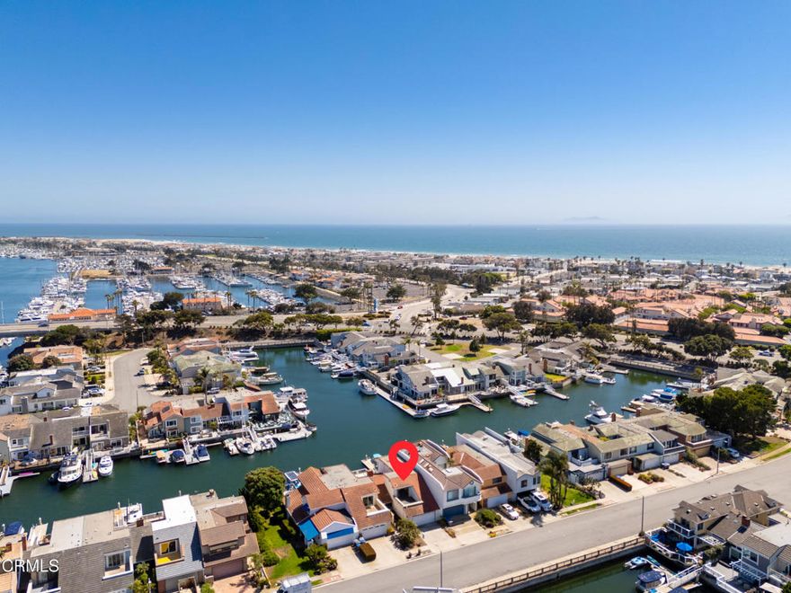 Experience California's best of coastal living in this beautifully updated, south-facing marina home with a private 40' boat dock, offering panoramic water views from every room. You won't believe what's been done since it was last on the market--every detail has been thoughtfully refreshed and refined. Prime location, Views of the Main Channel, combines coveted southern exposure with seamless indoor-outdoor flow and direct access to your private dock--perfect for your boat, water equipment, and toys. Designed for effortless living, the home showcases a remodeled kitchen with sleek stone countertops, modern cabinetry, and stainless steel appliances, complemented by new wood flooring and custom window shades throughout. Two spacious en suite bedrooms each capture stunning water views, while a versatile third bedroom offers flexibility as a den or office--also with water views. Spa-inspired bathrooms feature clean, contemporary vanities and premium finishes, including 2.5 beautifully updated baths. Fresh paint inside and out and a brand-new roof provide lasting peace of mind. Rare advantage! This home's private dock sits along one of the widest sections of the Channel Islands Harbor--offering nearly 2x the maneuvering space compared to typical docks, perfect for larger boats and stress-free navigation.  Cozy fireplace. 2 car garage, ample street parking. Conveniently located near waterfront dining, boutique shopping, and Ventura County's finest beaches--and surrounded by some of the most sought-after weather in the world. See the rest and compare--this is the one.