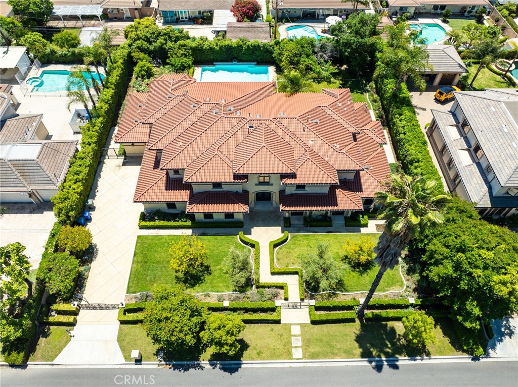 Seller offering 2-1 rate buydown to reduce buyer's interest rate!. Welcome to one of Arcadia’s most exceptional custom estates — a true showcase of timeless elegance, modern craftsmanship, and luxurious design. Completely rebuilt in 2017, this grand residence offers approximately 8,259 square feet of refined living space, perfectly situated on nearly half an acre of manicured grounds in one of the city’s most sought-after neighborhoods.
Behind its stately façade, double doors open to a breathtaking foyer featuring soaring ceilings, a dramatic dual staircase, and intricate hand-molded ceiling details that set the tone for the sophistication found throughout the home.
Thoughtfully designed across two expansive levels, the home features 6 spacious bedrooms and 6.5 bathrooms, including a stunning primary suite with its own private sauna and a spa-like bathroom retreat.
The first floor includes a beautifully appointed executive office, a dedicated media room, and two en-suite bedrooms, perfect for guests or multi-generational living. The second floor offers four additional bedrooms, each with its own distinct character and design.
Built for both intimate daily living and grand-scale entertaining, the residence boasts a seamless flow of formal and informal living areas. Enjoy two full kitchens, a custom wet bar, and elegant chandeliers that elevate nearly every room with timeless charm.
Step outside to your own resort-inspired backyard oasis, complete with a sparkling pool, expansive patio areas, and lush landscaping — ideal for outdoor gatherings or private relaxation.
A 3-car garage provides ample room for both vehicles and storage, while the entire estate reflects an unwavering commitment to quality and detail.
This rare offering represents the pinnacle of luxury living in Arcadia — an extraordinary home for those who demand nothing but the best.
Every corner of this estate reflects an unwavering commitment to quality, design, and elegance. A truly rare offering in the heart of Arcadia.