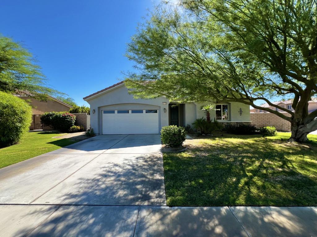Welcome to your next home in the vibrant, gated community of Terra Lago! This spacious 4 bedroom, 2.5 bathroom residence offers 2,478 sq ft of stylish living with an open-concept design that's flooded with natural light. The main floor features a generous great room and a bonus den--perfect for a home office, playroom, or creative space.The kitchen is a dream for any entertainer, with sleek GE Profile appliances, and tons of counter space to prep. Situated on a desirable corner lot that backs to a quiet greenbelt, the private backyard is ideal for weekend BBQs or winding down after a long day. A 3-car tandem garage gives you plenty of room for storage, bikes, or your desert toys.As a resident of Terra Lago, you'll enjoy exclusive access to the lake, clubhouse, fitness center--and HOA-covered perks like high-speed internet and basic cable.Don't miss this opportunity schedule your private showing today.