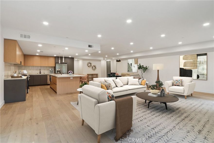 Welcome to this stunning first-level residence at The Pavilion, where contemporary design meets timeless sophistication in the heart of Valley Village. The thoughtfully designed open-concept floor plan is perfect for both entertaining and everyday living, featuring wide-plank engineered flooring, a sleek fireplace, and a private balcony that fills the home with natural light. The gourmet kitchen is a chef’s dream, complete with quartz countertops, stainless steel appliances, a center island with breakfast bar, pendant lighting, and an optional kosher-friendly layout. The spacious primary suite offers two custom walk-in closets and a spa-inspired bath with a walk-in shower, freestanding soaking tub, dual vanities, illuminated mirrors, and exquisite designer tile. Additional highlights include in-unit laundry and access to premier community amenities—subterranean parking, a fitness center, internet café, and a beautifully landscaped courtyard ideal for relaxing or entertaining. Perfectly situated in the heart of Valley Village near fine dining, boutique shopping, and entertainment, this residence at The Pavilion offers a rare opportunity to experience elevated living at its finest.