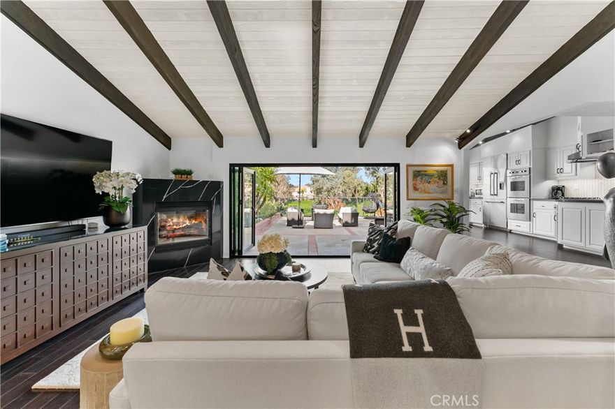 Welcome to Park Jazzmin. A gated waterfront residence on Calabasas Lake, redesigned with an emphasis on clean lines, natural finishes, and seamless indoor–outdoor living.

The main level is thoughtfully arranged to bring the lake into the living space. Custom accordion doors open the living room to the waterfront patio, while French doors connect the kitchen to a landscaped garden, creating a calm, open circulation between each space. The kitchen blends performance and simplicity with Viking appliances, custom stone counters, and generous storage space.

A bedroom and full bath on the main level offer privacy for guests, multigenerational living, or a dedicated office suite.

Upstairs, two full bedroom suites are positioned to capture views across the lake. The primary suite includes a private sitting room, a custom closet, and a newly designed en suite finished with refined materials. The secondary suite offers its own full bath and additional closet space.

Additional features include a dedicated laundry room and an attached two-car garage for everyday ease and functionality.

Park Jazzmin sits along a private cul-de-sac directly on the water, with access to the lakefront walking trail, community pool, spa, and tennis courts.