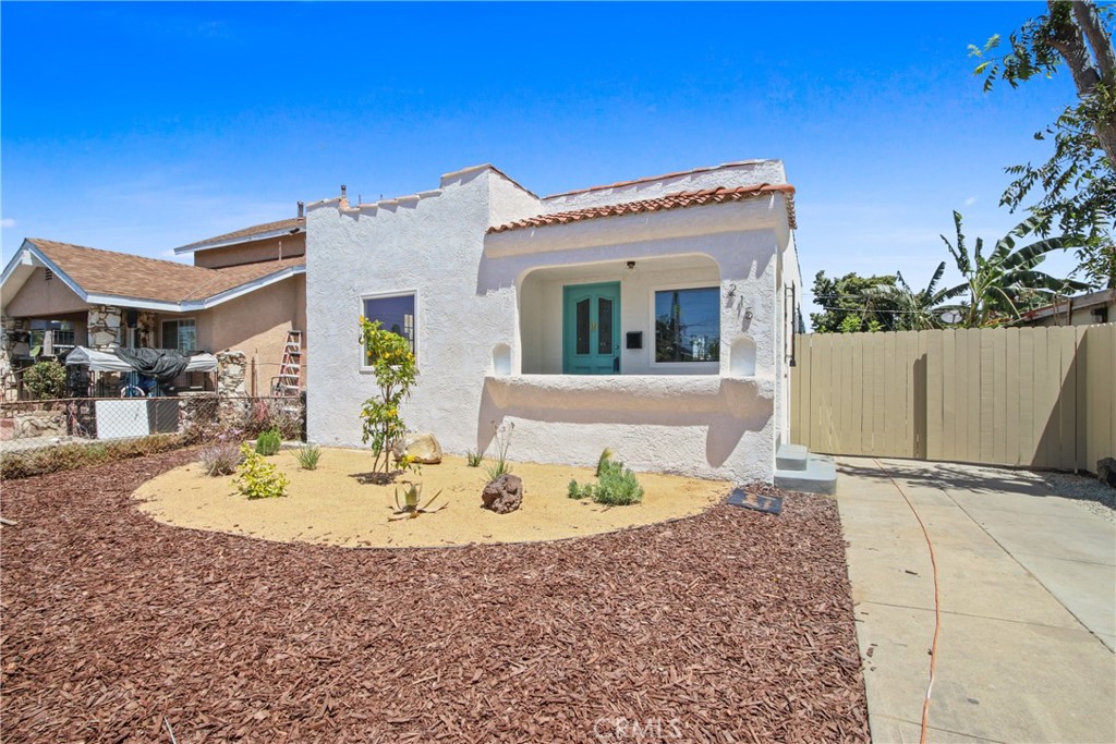 Looking for a beautiful Spanish-inspired gem in the heart of Broadway-Manchester? This 2-bedroom, 1-bath turn-key residence offers 930 sq ft of sunlit comfort on a generous lot! Inside, tall ceilings and bright windows bring warmth and energy to the open-concept layout. Designer lighting, wood-style floors, and crisp white walls create an inviting ambiance that flows throughout the living and dining areas. The kitchen shines with sleek appliances, plentiful cabinetry, a convenient breakfast bar, and tucked-away laundry hookups.
Two restful bedrooms share a stylish bath with contemporary finishes. Head outside and imagine the possibilities with an extended yard ready for weekend BBQs or even an ADU. The extra-long garage adds flexible storage or workshop space, while the gated driveway easily fits up to 4 vehicles. With updated plumbing and wiring, and a new roof, this home also qualifies for a rare $20,000 grant (no repayment) and 3% down, no mortgage insurance with City National Bank. With easy access to nearby schools and the 110 & 105 freeways, come see how effortlessly your next chapter could unfold!