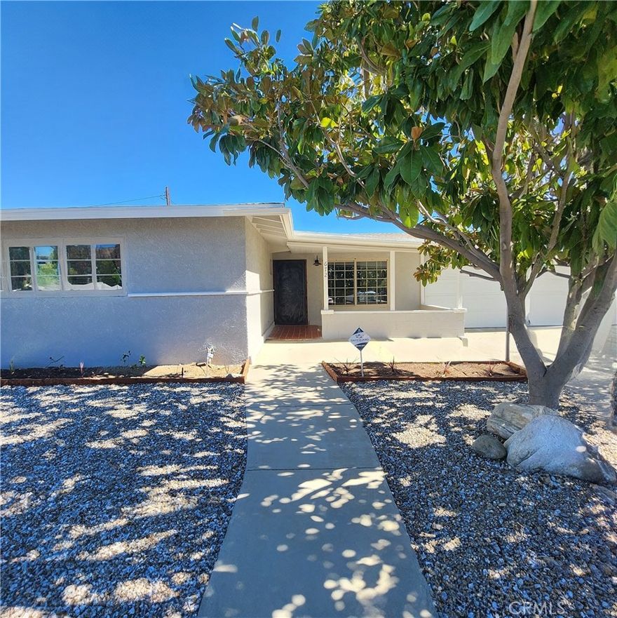 Are you looking for a cozy place to call home? Look no more and make this home yours! This beautifully remodeled home offers 3 bedrooms, 2 bathrooms, and many customs features like vinyl flooring throughout, newly remodeled kitchen with sleek quartz countertops, custom redwood door jambs, LED lights, smart garage opener (MYQ), aluminum patio, fully landscaped front and back yard, and a newer roof replaced only 2 years ago. This is just to name a few of the many features this home has to offer. Enjoy your evenings in the spacious backyard under the covered patio enjoying the fresh avocados and fresh lemons from your own trees while taking in the views of the Beautiful San Gorgonio and San Jacinto Mountains. Perfectly located near shops, schools, parks and only a few minutes away from the Cabazon outlets, City of Palm Springs and City Deserts. Don't miss the chance to make this your new home sweet home! This is a rare opportunity to own a turnkey property with space, style, and savings. Don't miss out—schedule a showing today!