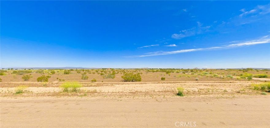 Corner lot opportunity in California City offering 0.28 acres of flat, buildable land at the intersection of paved Mitchell Blvd and Walpole Ave. This residential-zoned parcel provides easy road access with development potential for your custom home or investment project. Property requires septic and well installation, with electricity available approximately 1,000 feet away along Xavier Ave - buyer to verify all utility connections and explore public water availability in the area. Located in Kern County's third-largest city by area, just 100 miles north of Los Angeles with access to outdoor recreation including Red Rock Canyon State Park and Mojave National Preserve. The flat terrain and corner positioning offer flexibility for site planning and future construction. California City continues infrastructure improvements while maintaining affordable land prices, making this an attractive entry point into California real estate. Perfect for off-grid living, weekend retreat, or long-term investment in a growing high desert community. APN 218-091-21-00-2, GPS Coordinates 35.12960 -118.012070