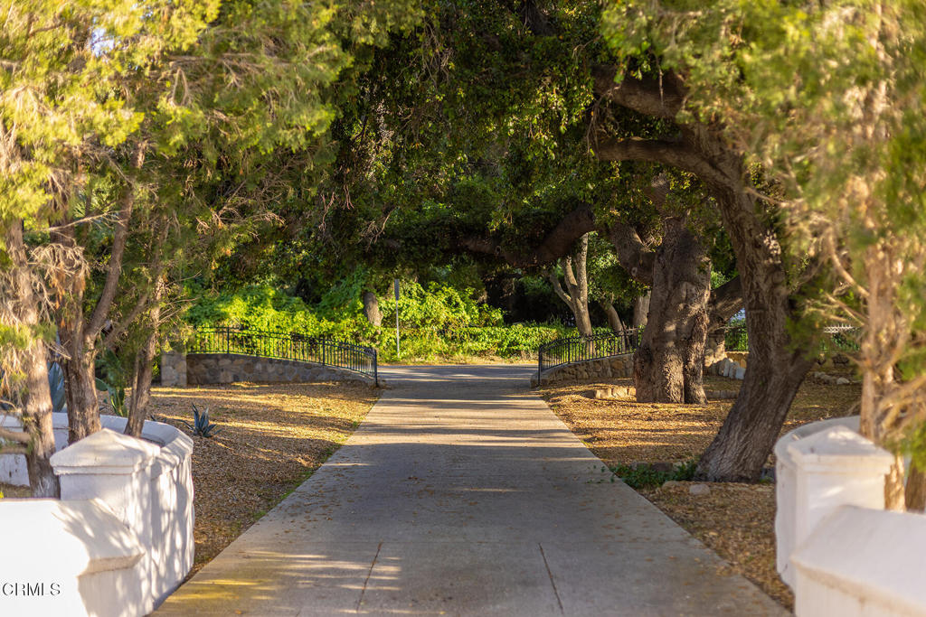 Totem Ranch is a secluded yet conveniently situated 40 acre citrus ranch in the heart of Ojai's East End neighborhood. Only a few minutes drive to downtown Ojai and its wonderful community, but not sacrificing a single ounce of rural and agricultural charm. This property has something for everyone with four separate dwellings, pristine and certified organic orange orchard amongst an oak studded bucolic landscape. In addition to the 3500 sq-ft house main house, there are three other houses, a large barn complex, a driveable bridge for exclusive access to the main house, and driveways and roads create a sort of private creekside village throughout the property. Boutique groves wrap around the back of the main house with 25+ varieties of subtropical fruit; and a market-garden planted field surrounded by nut-bearing pecan trees make a botanical hotspot. All of the built structures are in excellent condition and lend themselves easily to turn-key farmworker dwellings or rentals. The total acreage and 2 distinct parcels provides everything one could need; a primely located farm with multiple viable income streams, a beautiful home for you and your family, and ample room to build and dream in the future.