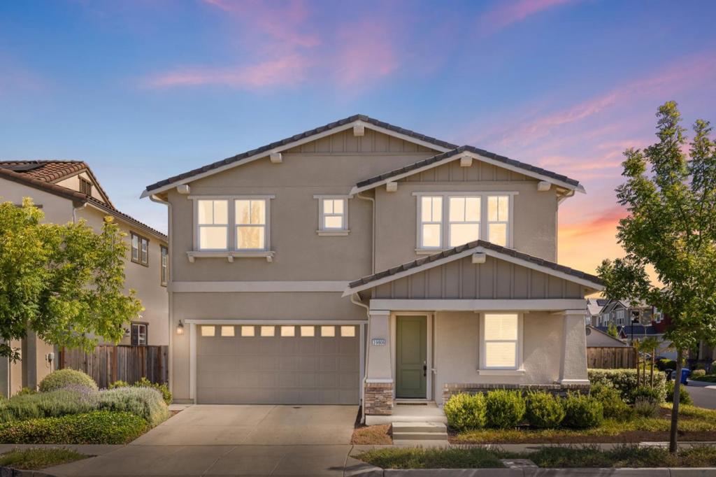 Built in 2019 by KB Homes, this modern Craftsman on a sunlit corner lot features 4 bedrooms, 3 full bathrooms spanning 2299 sqft on a 4,389 sq ft lot, with ample backyard space. Features include custom wainscoting, luxury vinyl plank floors, surround sound ready and a full bed and bath on the main level. The open-concept kitchen/living/dining area flows to a finished backyard with gazebo. The kitchen features a full pantry closet, professional KitchenAid appliances and designer touches. Upstairs offers a spacious primary suite with sunken tub, dual sinks, and dual closets, plus a spacious family room loft, two bedrooms, full bath, and laundry. Luxury carpeting throughout the second level creates comfort and warmth. Stylish, functional, and move-in ready!