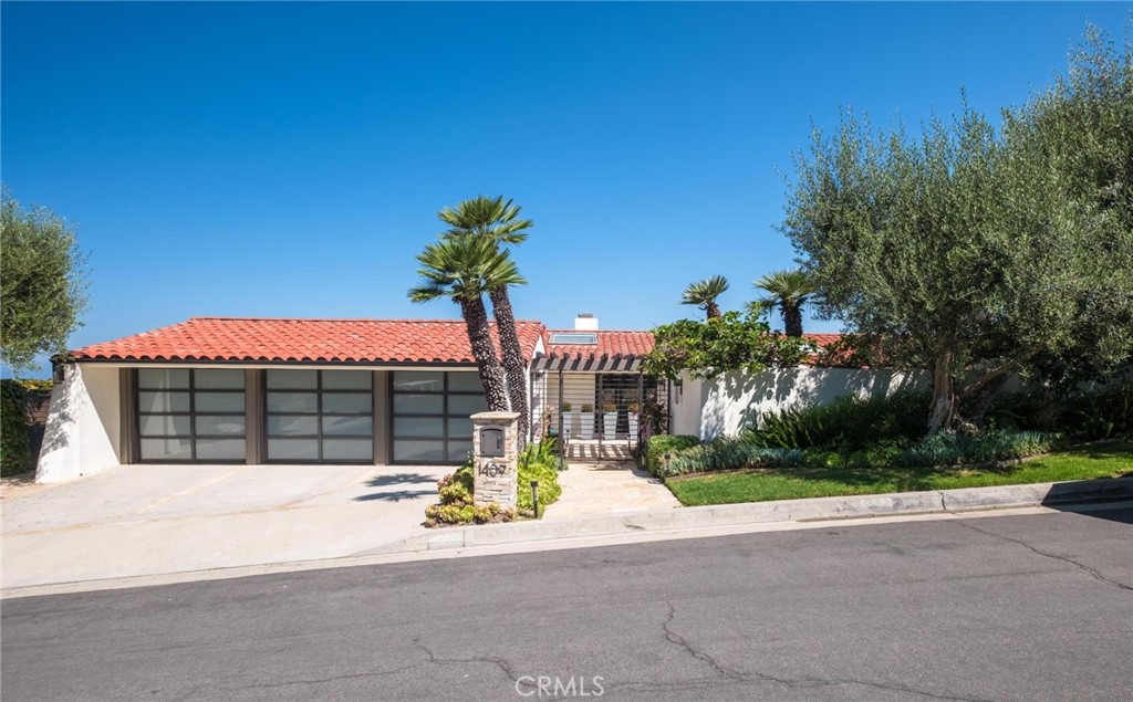 Discover the perfect blend of elegance, comfort, and awe-inspiring views in this exceptional single-family residence, nestled in the prestigious enclave of Palos Verdes Estates. Recently renovated and impeccably styled, this expansive 4,448-square-foot home features six generously sized bedrooms and three and a half beautifully updated bathrooms—ideal for both refined everyday living and effortless entertaining.
Wake up to sweeping panoramic vistas of the Queen’s Necklace and the Pacific Ocean from nearly every room—an ever-changing masterpiece of shimmering city lights and unforgettable sunsets. Designed to maximize natural light, the home showcases floor-to-ceiling windows and strategically placed skylights that bathe the interiors in a warm, inviting glow.
At the heart of the home, the chef’s kitchen is a true showpiece. Outfitted with premium JennAir appliances—which have panel-ready units that blend seamlessly into the sleek, modern aesthetic—this space is both visually stunning and highly functional. The kitchen opens directly to the expansive living and dining areas, creating a fluid environment perfect for culinary creativity, entertaining guests, or enjoying intimate family moments.
Downstairs, the lower level offers a dedicated Media Room/Entertainment Lounge, flanked by two distinct bedroom wings for added privacy. The south wing features two bedrooms and one bathroom, while the north wing includes three additional bedrooms and another stylishly appointed bathroom. This level also includes a wet bar and a wine storage room, making it ideal for hosting movie nights, game days, or elegant wine tastings.
Step outside to your own private resort-style retreat, where a sparkling pool, built-in BBQ, and outdoor refrigerator set the stage for endless summer gatherings. A cozy fire pit lounge offers the perfect spot to unwind under the stars while soaking in more incredible coastal views. The lush, landscaped yard and multiple spacious balconies invite relaxation—from sunrise coffee to sunset cocktails.
This is more than just a home—it's a private coastal sanctuary where luxury, serenity, and panoramic beauty converge in one of Southern California’s most coveted neighborhoods.
