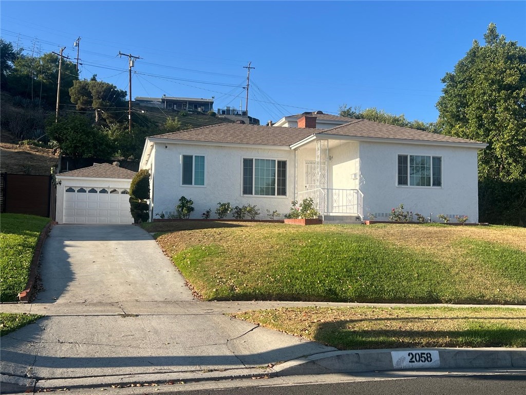 Welcome to this stunning 4-bedroom, 2-bathroom home located in one of Monterey Park’s most sought-after neighborhoods. Featuring dual-pane windows throughout, the home is filled with natural light and offers a warm, inviting atmosphere. The cozy living room leads into a gourmet kitchen complete with abundant cabinet space and a brand-new cooktop—perfect for any home chef. The private master suite includes a renovated, modern bathroom, offering comfort and style. Step outside to a spacious backyard, ideal for entertaining guests or enjoying quiet evenings outdoors. A long driveway leads you to a detached two-car garage. Convenient location to shopping centers, restaurants, schools and freeway access. Don't miss this opportunity to move-in this beautiful property.