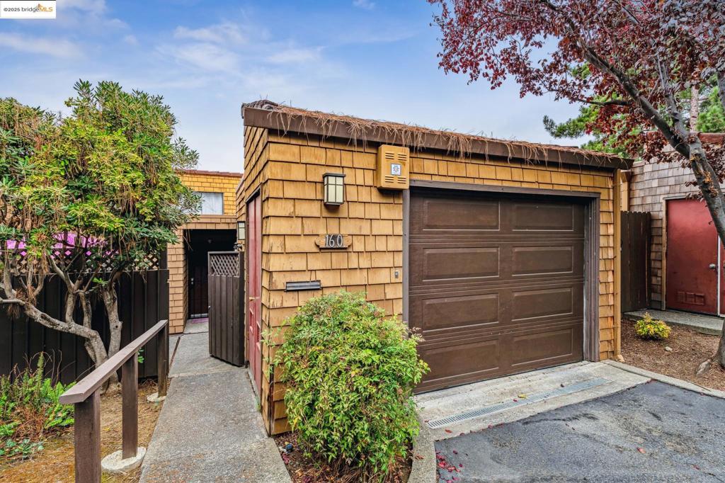 Welcome to this beautifully maintained 2-bedroom, 2-bathroom end-unit condo with no adjoining walls, in the desirable Vallejo Cerros community. Thoughtfully designed for both comfort and style, this home features soaring cathedral ceilings in the living room and primary bedroom, creating a bright, airy ambiance throughout. Enjoy indoor-outdoor living with both rooms opening onto a serene deck, surrounded by mature trees and greenway views—perfect for relaxing evenings or morning coffee. Inside, you'll find bamboo flooring, designer colors, and a spacious layout. The functional kitchen includes a breakfast bar, and a formal dining area with access to the private patio—ideal for entertaining. The primary bedroom boasts an en-suite bathroom and ample closet space, while the updated hall bath serves guests and the second bedroom comfortably. Additional highlights include a cozy fireplace with a custom mantel, in-unit laundry, central heating and air conditioning, and interior access to the one-car garage. This quiet and private community offers resort-style amenities including a sparkling pool, tennis court, clubhouse, and recreation room. With easy access to I-80 and Columbus Parkway shopping, this home is a commuter's dream and a rare find in a sought-after location.