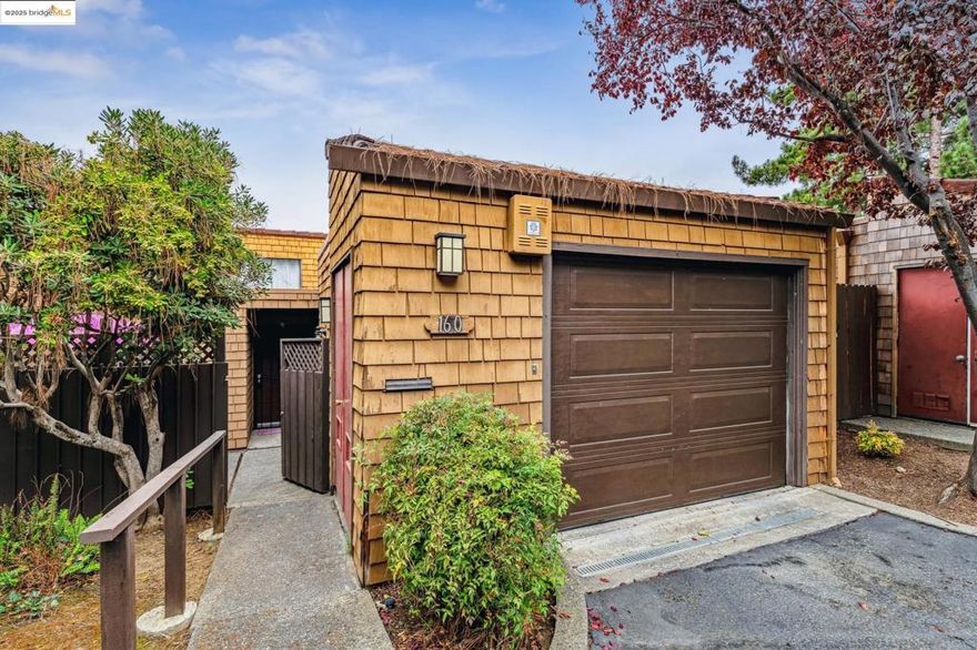 Welcome to this beautifully maintained 2-bedroom, 2-bathroom end-unit condo with no adjoining walls, in the desirable Vallejo Cerros community. Thoughtfully designed for both comfort and style, this home features soaring cathedral ceilings in the living room and primary bedroom, creating a bright, airy ambiance throughout. Enjoy indoor-outdoor living with both rooms opening onto a serene deck, surrounded by mature trees and greenway views—perfect for relaxing evenings or morning coffee. Inside, you'll find bamboo flooring, designer colors, and a spacious layout. The functional kitchen includes a breakfast bar, and a formal dining area with access to the private patio—ideal for entertaining. The primary bedroom boasts an en-suite bathroom and ample closet space, while the updated hall bath serves guests and the second bedroom comfortably. Additional highlights include a cozy fireplace with a custom mantel, in-unit laundry, central heating and air conditioning, and interior access to the one-car garage. This quiet and private community offers resort-style amenities including a sparkling pool, tennis court, clubhouse, and recreation room. With easy access to I-80 and Columbus Parkway shopping, this home is a commuter's dream and a rare find in a sought-after location.