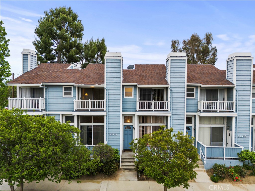 Price Improvement! Nice 2 bedroom 2 1/2 bath townhome located in lovely area of Chatsworth. This unit has well maintained wood flooring and brand new paint through out. Enter this perfectly maintained home into a spacious high ceiling living room with gas fireplace that sheds plenty of natural light through the large sliding door that leads out to your personal private patio perfect for dining al fresco or just relaxing with a good book. Elevated dining room over looks the living area with this open layout and still has easy access to the kitchen, perfect for the entertainer. Well appointed kitchen includes brand new stove, microwave with exhaust feature and dishwasher plus brand new kitchen faucet with a beautifully large garden window to grow your own little herb garden or plants. This unit also has the amazing perk of direct access garage with additional storage space. Close freeway access to the 118. Close to dining, shopping even the train station is near by for the buyer who commutes.
