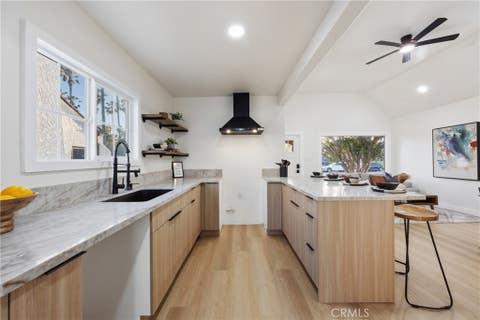 Photo of 5613 S Rimpau BLVD, Los Angeles, CA 90043 (MLS # DW26145499)