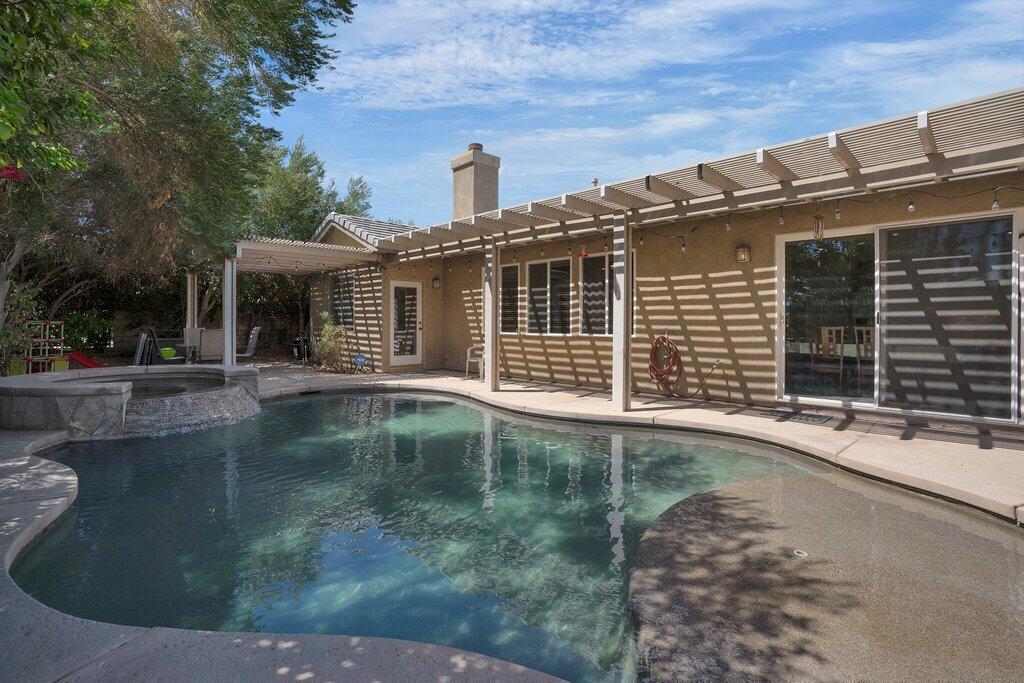 Located in the desirable, guard-gated Indian Palms Country Club, this beautifully maintained home offers resort-style living and even investment potential. With 4 bedrooms and 3 bathrooms, including a detached Casita, it provides the ideal setup for guests, extended family, or lucrative short-term rental income -- especially during festival season. The heart of the home features a huge open-concept living area with a spacious kitchen island seamlessly flowing into the living room, perfect for entertaining. The thoughtful floor plan offers excellent separation of space between the primary suite and the secondary bedrooms, ensuring privacy and comfort. Step outside to your own private desert retreat -- a sparkling in-ground pool and spa, covered seating area, and mature landscaping that enhances privacy and creates the perfect backdrop for outdoor relaxation. Additional highlights include: Over-sized garage with room for recreational toys, tools, and storage, beautifully landscaped lot within a golf course community, access to Indian Palms amenities including golf, tennis, and clubhouse facilities. Whether you're seeking a primary residence, vacation getaway, or high-demand short-term rental, this property offers it all in one of Indio's most sought-after locations. Schedule your private showing today and experience the best of desert living!