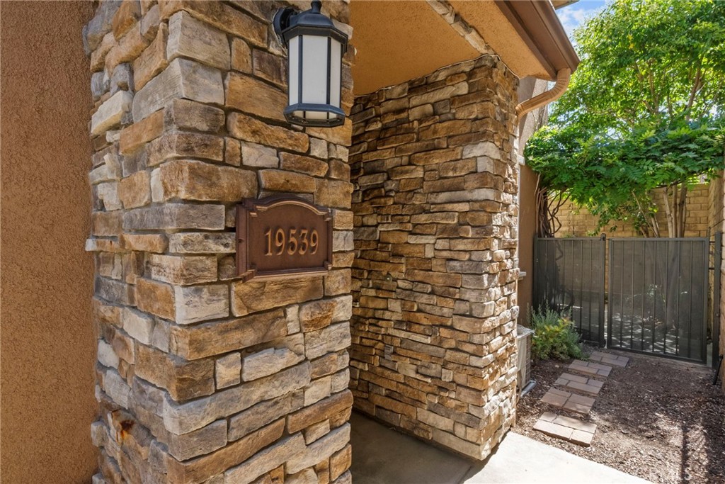 One of the Most Private Homes in the Community is Now Available!
Don’t miss this rare opportunity to own one of the most private homes in this sought-after neighborhood. Tucked away in a quiet, secluded location, this home offers comfort, charm, and functionality from the moment you arrive.
One of the standout features of this property is the shaded, private backyard—perfect for relaxing with a book or entertaining friends and family in a peaceful setting.
Welcoming and Secluded Entry. The front entryway is tucked away from the street, providing added privacy and security—ideal for those who value tranquility.
Step inside to a spacious living room complete with a cozy fireplace, custom baseboards, and crown molding that add a touch of elegance. The open layout continues into the dining area and well-appointed kitchen, featuring beautiful cabinetry, updated countertops, a newer GE oven/stove, and a newer GE dishwasher.
Upstairs, both the primary and secondary bedrooms feature their own en-suite bathrooms and generous closet space—making this home ideal for guests, roommates, or multi-generational living.
Enjoy energy-efficient living with a whole-house fan that helps keep the interior cool. The attached, insulated garage adds extra value—great for storage or a workshop—and connects directly to the laundry area, which stays comfortable year-round thanks to the garage insulation.
Community Perks:
The HOA includes access to a pool, spa, and BBQ area. And here are the words every buyer loves to hear: Low HOA dues and NO Mello Roos!
This is a Prime Location as it is Situated in a vibrant area of Santa Clarita, you're just steps from popular local favorites—Sushi, Italian restaurants, fitness studios, and a trusted vet clinic. People from all over the valley come here to enjoy what you’ll have right outside your door. *The living room and kitchen photos have been digitally staged