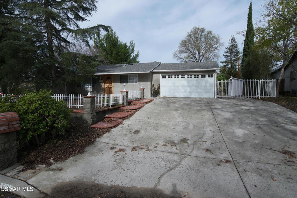 This property offers a fantastic living space, move-in ready with a fresh coat of paint, newer flooring, and updated window treatments throughout. Featuring four spacious bedrooms and two baths, the home includes a cozy living room with a fireplace, perfect for relaxation. The kitchen is equipped with new stainless steel appliances and tile countertops, ideal for cooking and entertaining. The master bedroom boasts two large walk-in closets, providing ample storage space. The home also offers upgraded windows, newer central heat and air, and a two-car garage with a roll-up door. RV parking is available, and the property is conveniently located near shopping, dining, and outdoor activities like hiking and biking trails. Don't miss the opportunity to make this wonderful home your own!