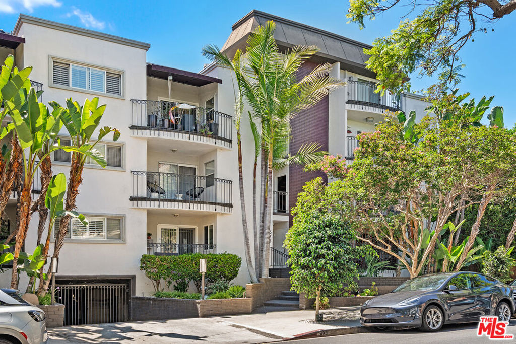 Located in the heart of West Hollywood on a quiet, tree lined street between The Beverly Center, The Grove and 3rd Street, you'll enjoy easy walks to the famed Melrose Place, shops, grocery store, restaurants and much more. This top floor corner condo is away from the street with a lovely balcony facing west and ideal to watch the sunset. Two bedrooms, two bathrooms corner unit provides great natural light (south/west exposure) and plenty of space, plus built in cabinets and tons of closet space. New central heat/air. Enjoy a private balcony looking up to the hills, laundry in unit and onsite community laundry room, two tandem subterranean parking spots with gate and security cameras, plus extra storage. New floors, upgraded bathrooms and hallways have been recently remodeled. A bright quiet penthouse in the heart of West Hollywood.