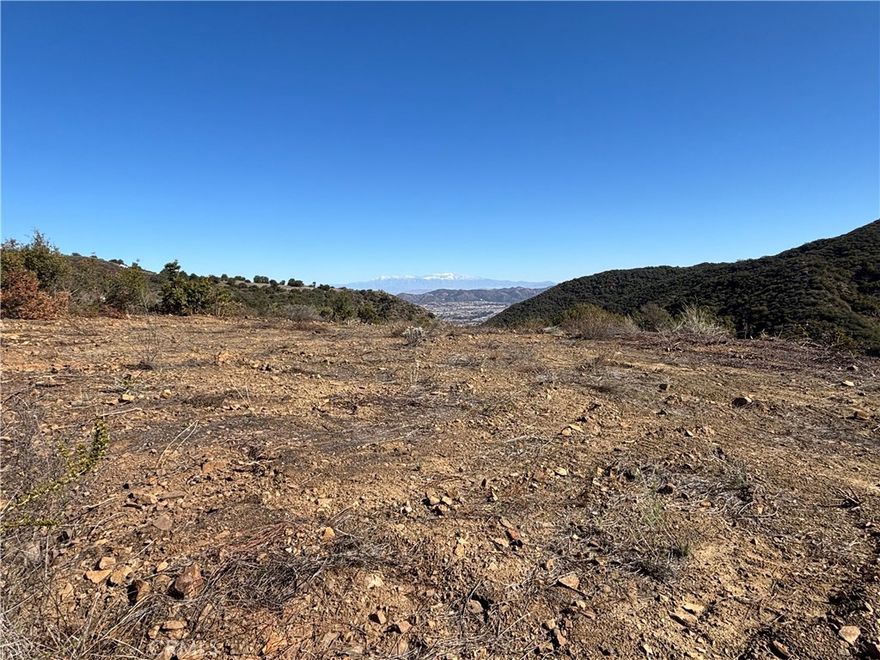PRICE TO SELL!! Embrace the opportunity to own 13 acres of pristine land in the exclusive La Cresta community of Murrieta. This expansive parcel offers breathtaking panoramic views of the surrounding hills and valleys, providing an idyllic setting for your custom dream home, equestrian estate, or vineyard. Situated among rolling landscapes and multi-million-dollar estates, this property ensures both privacy and prestige. Enjoy the tranquility of rural living while remaining conveniently close to Murrieta’s top-rated schools, shopping, dining, and only 7 minutes from the I-15 freeway, facilitating easy commutes. Key features include: • Graded building sites: Design your estate to capture the most stunning vistas. • Utilities nearby: Simplifying the development process. • Proximity to equestrian trails: Ideal for horse enthusiasts. • Close to Temecula’s renowned wine country: Enjoy weekend excursions to nearby vineyards. Additionally, this property is just minutes away from the historic Reagan Ranch, formerly owned by President Ronald Reagan. Known as the Buffalo Ranch, this 30-acre estate in the scenic Tenaja Valley has become a local landmark, featuring an FAA-approved private runway, a tranquil spring-fed lake, and a charming cabin-style home. ? This rare offering in La Cresta provides a blank canvas to bring your vision to life. Whether you aspire to cultivate a vineyard, establish an equestrian haven, or build a luxurious retreat, this property offers the perfect backdrop. APN # 930-120-011 Please do not trespass, schedule a showing with the listing agent.