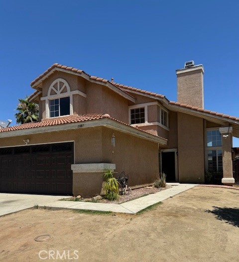 This beautiful, updated home features 4 bedrooms and 3 bathrooms with 1 bedroom and 1 full bathroom located on the first-floor level. A cozy living room with a fireplace that is connected to the dining area. The family room is right off the kitchen area with access to the patio. The kitchen is equipped with new counter tops and newer cabinets. Fresh new paint and laminate flooring throughout the house, new ceiling fans, and upgraded bathroom counters. The backyard has plenty of space to make it your own oasis for gatherings. The home is centrally located near shopping centers and conveniently located off the 215 freeway for easy commute. This home is move-in ready!