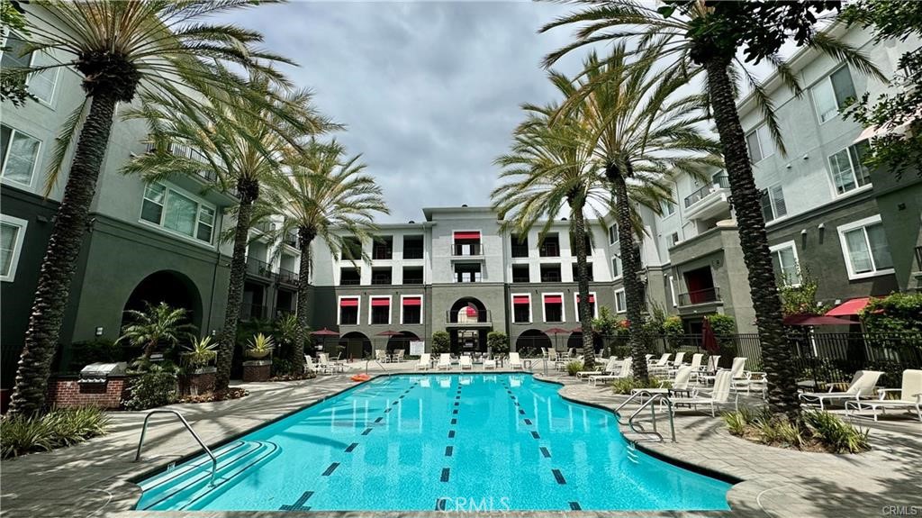 Welcome to Stadium Lofts, your urban oasis situated in the vibrant Platinum Triangle of Anaheim. This stunning condominium offers the perfect blend of convenience, luxury, and modern living, ideal for those seeking a dynamic Southern California lifestyle. Enjoy unparalleled access to major attractions such as Angel Stadium, Honda Center, Disneyland, The Block of Orange, The Garden Walk, and the Amtrak Station. This well-appointed condo boasts an expansive 1,095 square foot layout featuring two bedrooms and two bathrooms, providing ample space for relaxation and entertainment. The open floor plan seamlessly connects the living, dining, and kitchen areas, making it perfect for hosting gatherings or enjoying quality time with loved ones. Recent upgrades include new hardwood flooring, modern bathroom fixtures, and stylish cabinetry, enhancing the condo's contemporary design and high-quality finishes. Unwind on your private enclosed deck, an ideal spot for outdoor relaxation. Enjoy the convenience of a fully equipped indoor laundry room, generous closet space, and two assigned parking spaces. Embrace the array of desirable amenities offered at Stadium Lofts, including a resort-style pool, spa, BBQ grills, cozy fire pit, rejuvenating sauna, well-equipped weight room, newly added Peloton room, entertaining pool table and shuffleboard, communal kitchen area, and a functional business center. Benefit from the 24/7 security guard, gated community, EV charging stations, clubhouse, and Amazon Locker. Rent includes water, trash, and internet for your convenience. Don't miss the opportunity to call this beautiful condo your home. Whether you're a young professional, a small family, or anyone in between, this condo offers a fantastic chance to experience the best of Anaheim living. Contact us today!