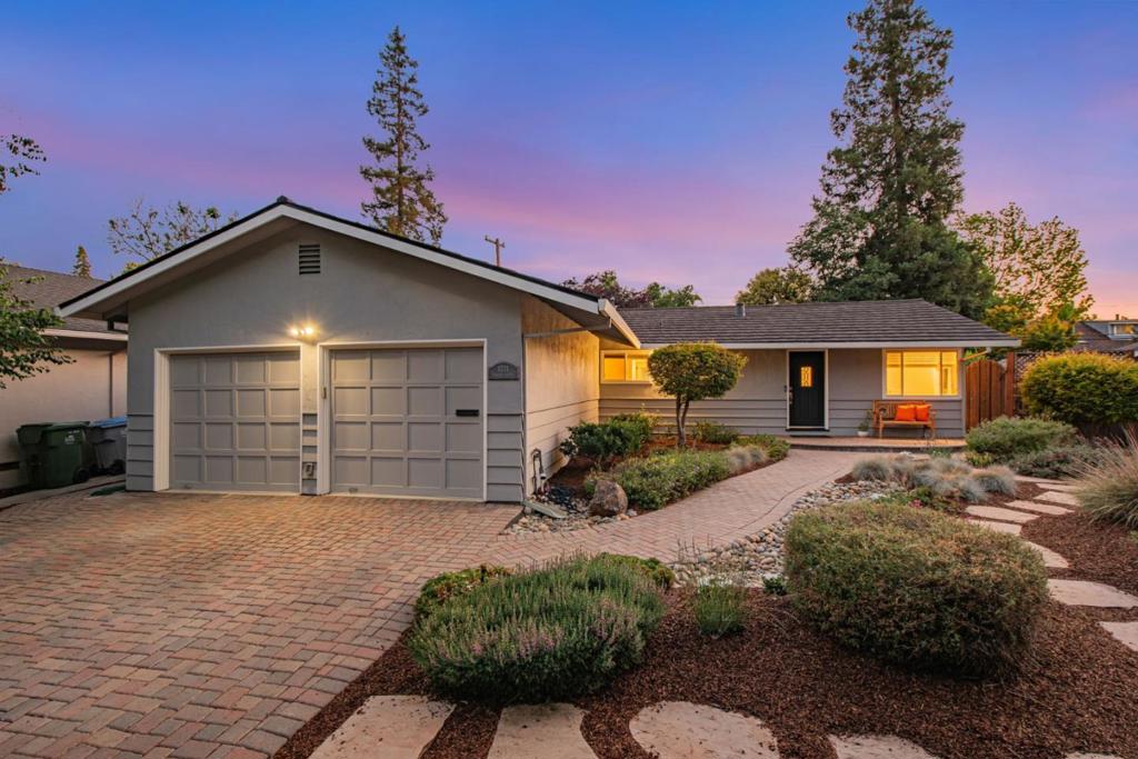 Beautiful home with a HUGE 1,180 sf. finished basement with no pillars to get in the way. There is also a sump pump, dehumidifier, 11ft. reinforced tie back system, new carpet, lighting and paint that brings the usable space to a total of 2,510sf.! The kitchen has solid quartz counters, gas stove and stainless steel appliances. The hardwood floors are newly refinished, there is fresh paint throughout as well as updated LED lighting. The inside laundry area has extra storage and in the attached garage you'll find the water filtration system. The HVAC was recently updated with central A/C as well as the lifetime metal roof and newer water main. Refreshed yards with pavers, drought resistant features, french drains and fruit trees. The spacious yard has room for expansion, gardening and entertaining. Close to downtown Willow Glen, schools, freeways and it is across the street from River Glen Park with multiple playgrounds as well as tennis, pickleball, baseball and basketball.