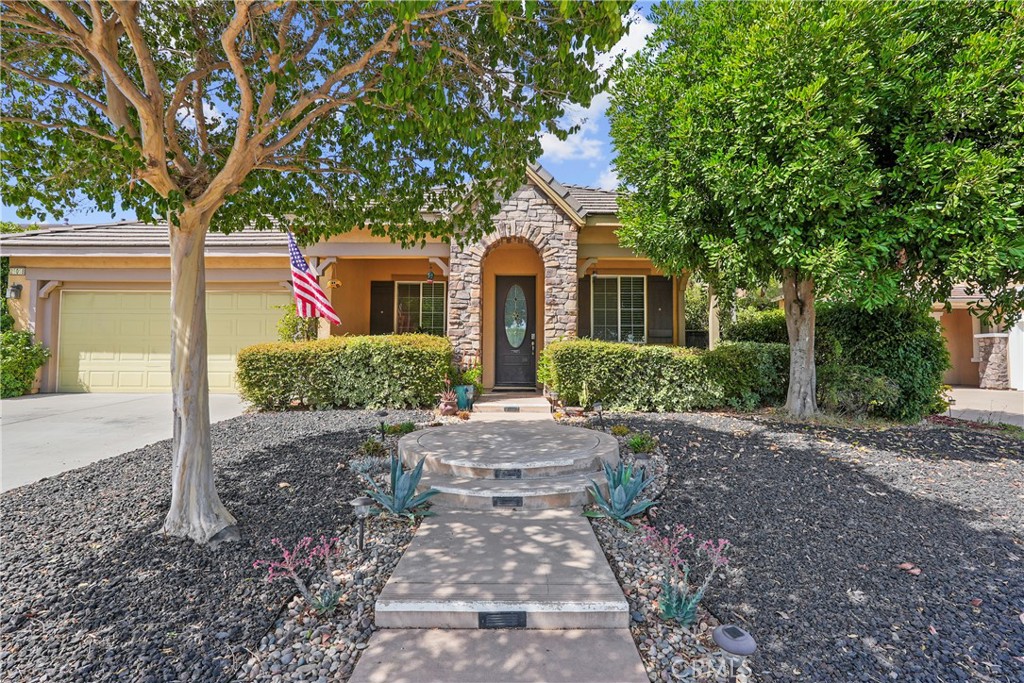 Welcome to this beautifully upgraded 4-bedroom, 3-bathroom home with a spacious loft, located in the desirable Clayton Ranch community of Wildomar. Offering 2,621 sq. ft. of living space, this residence features a unique open floor plan with soaring vaulted ceilings that fill the home with natural light.
The chef’s kitchen is the heart of the home, showcasing a large island, ample counter space, and modern finishes—perfect for entertaining and family gatherings. Enjoy the elegance of hardwood floors throughout the downstairs and a seamless flow into the inviting living and dining areas.
Upstairs, you’ll find a versatile loft space ideal for a home office, playroom, or media area. The bedrooms are generously sized, with the primary suite offering a private retreat complete with an en-suite bathroom.
Additional highlights include a two-car garage, a beautiful layout designed for comfort and style, and a location just minutes from the 15 and 215 freeways for easy commuting.
This home has been recently upgraded and is move-in ready—don’t miss your chance to own this exceptional property!