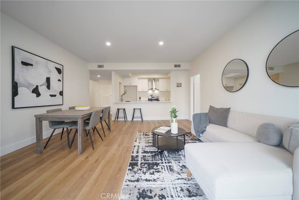 Welcome to your dream Talisman 2 bds & 2 baths condo in the heart of Beverly Grove, spacious, full of natural light, and totally vibe-worthy. The kitchen is a full-on glow-up with sleek quartz counters, a stylish backsplash, stainless steel appliances, and recessed lighting that makes everything pop. The open living area is perfect for chill nights or entertaining, complete with a decorative fireplace and a large private balcony that connects to the primary suite (hello, indoor-outdoor flow!). Both bathrooms have been tastefully remodeled, and there's plenty of closet space — including a walk-in in the primary. The updated SPC luxury vinyl flooring adds a modern, low-maintenance touch throughout. You’ll also love the gated tandem parking for two cars and extra storage. And let’s talk location — you’re just steps away from West Third Street’s iconic dining and shopping, The Grove, Beverly Center, Beverly Connection, Trader Joe’s, and Cedars-Sinai. Basically, it's giving lifestyle, convenience, and major main-character energy.