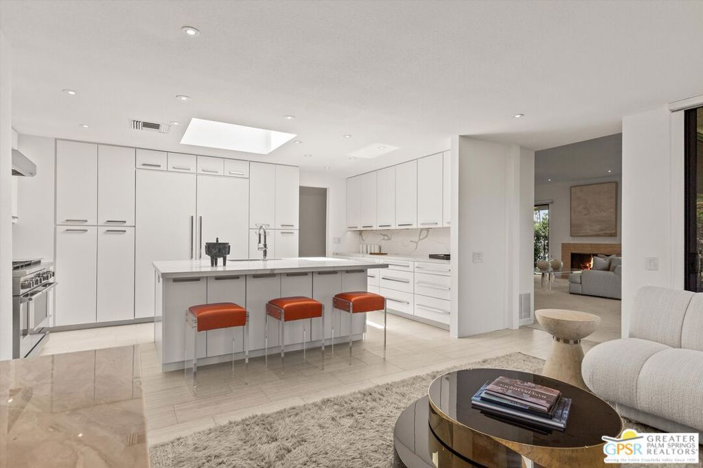 Extensively remodeled, NOW ready to occupy and enjoy for this season! Perfect for entertainment and a truly carefree lifestyle are yours in this highly upgraded residence with thoughtful designer details that exudes luxury and refinement. Nestled within the highly desirable inner sanctuary of The Springs Country Club away from traffic, this highly sought after Shaughnessy floor plan offers truly sophisticated living. This meticulously remodeled 2,950-square-foot residence, featuring three ensuite bedrooms, is a haven of modern comfort and style. Savor western and southern mountain vistas from your prime location adjacent to the spectacular 48,000 sf Clubhouse renovated in 2021. The living room, with its welcoming marble fireplace and expansive ten-foot ceilings, and adjacent full wall wet bar creates an atmosphere of refined comfort. The gourmet kitchen is a culinary enthusiast's delight, showcasing high-end Fisher & Paykel appliances: a 30-inch column refrigerator and freezer, a five-burner stove with griddle and dual ovens, and a dual-drawer dishwasher. Solid quartz countertops and backsplashes lend an air of elegance. This home is designed for ultimate comfort, featuring Kohler's top-tier fixtures throughout. The principal primary bathroom is a highlight, with custom quartz sinks, a freestanding Kohler Garden tub, and an electronic bidet. Enjoy separated dual primary suites plus a guest suite/media room/home office off the foyer. All bathrooms are equipped with adjustable LED lighting, anti-fog mirrors, and Hunter Douglas shades for added privacy. All bedrooms comfortably accommodate king-sized beds. Completing this exceptional desert residence is a oversized three-car garage with storage. This is a rare opportunity to own a truly remarkable home. Private outdoor living awaits you in the private, Tuscan-inspired 20x25 courtyard, ideal for sunbathing, a safe haven for pets and children, or a future spa/pool. Maximize your budget with the adjacent HOA-maintained pool/spa, a valuable amenity included at no extra cost. Experience the serene tranquility of this cul-de-sac gem. Schedule your private viewing today and begin your journey home. NOTE: Frosted doors and spa/pool-deck shown in courtyard were digitally added to show future owner expansion options if desired. The monthly HOA fee includes: 24/7 guard gated community, roof maintenance (flat section last done in 2021), exterior painting every 6 years, wi-fi internet, Two DVR boxes with HBO & Showtime, social events, 9 tennis courts, 12 pickleball, 2 bocce ball, golfing, swimming and fitness center with 46 community saltwater pools and spas, 5 Lap pools! Plus, use of the Clubhouse and Oasis Cafe.