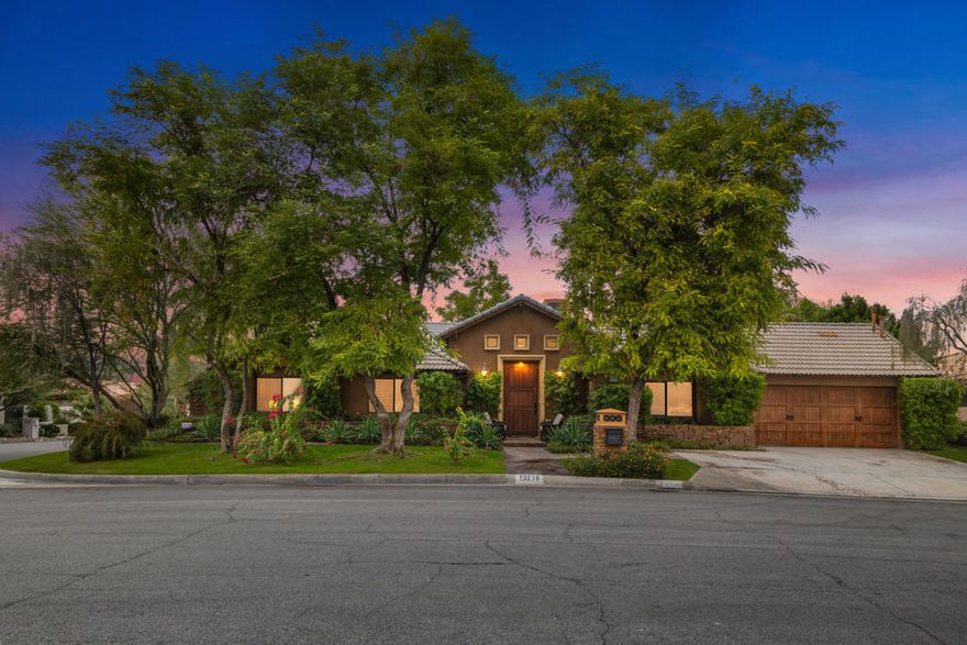 Discover an exceptional opportunity in the heart of South Palm Desert, just minutes from the shops and dining of El Paseo. Positioned on an oversized, elevated corner lot, this property commands panoramic mountain views from the front door and sits in one of the area's most established, sought-after neighborhoods. Inside, a dramatic entry sets the tone for over 3,000 sq. ft. of spacious living. The floorplan includes a generous primary suite, two large secondary bedrooms, and three well-appointed baths, plus a three-car garage for abundant storage. The backyard is a true private resort: a large modern pool, spa, covered patio, and lush tropical vibrant landscaping. Mature plantings create privacy and a serene backdrop for everyday living or effortless entertaining. With no HOA dues and endless potential to enjoy now or customize to taste, this South Palm Desert property is a rare find.