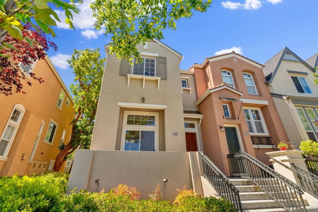 PARKSIDE CORNER HOME W/ UPGRADES | Nestled in one of the finest locations in all of Rivermark, this corner townhome across from Live Oak Park blends peaceful parkside living with excellent access to community amenities. A variation of the Park Plan III, beautifully updated interiors feature windows on three sides, allowing cascades of natural light throughout the breezy, open layout. Enjoy upgrades like new luxury floors, fresh paint, and stainless appliances, including a gas range and LG® Smart ThinQ refrigerator. Versatile gathering areas connect to a patio overlooking the park, perfect for indoor- outdoor enjoyment, and the remodeled kitchen boasts surround sound wiring, pristine cabinetry, and granite countertops with mosaic backsplash. The sun-lit primary suite showcases park views, a spa-like bath, and oversized walk-in closet. Additional highlights include upper laundry, dual-zone AC, smart amenities, and oversized, attached two-car garage with crawlspace storage. Stroll to shopping and dining at Rivermark Village, Don Callejon School, the community pool, library, and more!