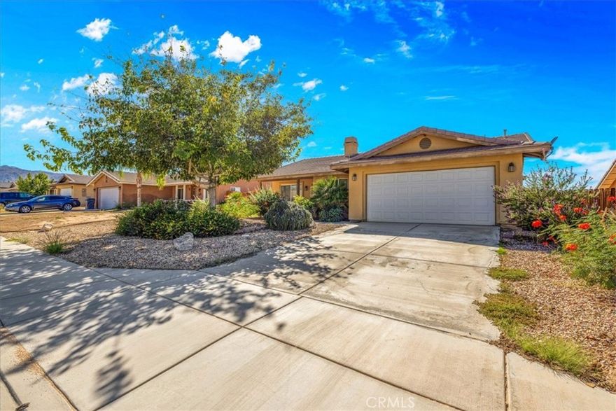 Built in 2007, this well-maintained 3 bedroom, 2 bath home offers 1,314 sq. ft. of comfortable living space in a desirable 29 Palms neighborhood. Thoughtfully updated, the home features a brand-new AC unit, fans in each bedroom, new microwave, replaced refrigerator water filter, new water heater pilot light, and even new toilet seats for a fresh, move-in-ready feel.

The front yard is beautifully landscaped with rock ground cover, irrigated shrubs, and a large shade tree—all maintained by an active sprinkler system and covered under the private HOA ($162/month). The spacious backyard is fully fenced with a quality wooden fence and protective wooden barriers, plus three large irrigated trees that provide both privacy and greenery.

Located just minutes from the Marine Base, Joshua Tree National Park entrance, grocery stores, and downtown 29 Palms, this home offers both convenience and comfort. With its unique upgrades and features, there’s truly no other home like it in the development.