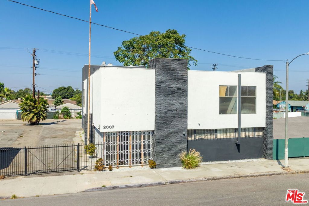 PRICED TO SELL - BRING ALL OFFERS! Prime opportunity to acquire a 100% vacant, recently renovated 8,466 SF free-standing Retail/Office Building in the heart of Los Angeles - Located in an Opportunity Zone! The first and second floors contain approximately 12 office suites, shared restrooms on both levels, and an elevator. This multi-tenant, two-story building, built in 1964 and renovated/upgraded in 2022/2024, sits on a 13,467 SF lot (total size with adjacent parcel), and is ideal for medical offices, educational institutions, professional workspaces, or retail businesses. Featuring secured gated entry, high-end finishes, ample parking, contemporary lobby with floor-to-ceiling windows, new rooftop HVAC systems. Prime street frontage on E Compton Blvd with over 20,000 VPD. The property features 24 dedicated parking spaces, providing convenient access for tenants and visitors. This building would appeal to an Owner/User seeking to occupy the top or bottom floor and rent out the suites for income.