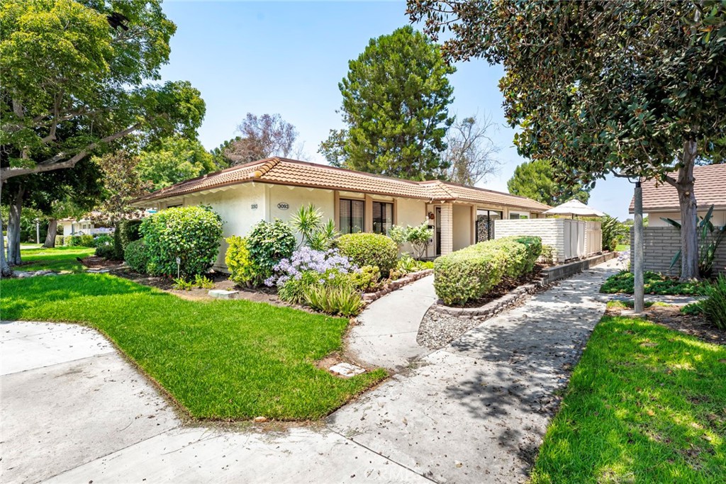 Welcome to 3093-B Via Serena N – Remodeled Hermosa Model in the Heart of Laguna Woods! Tucked into a quiet cul-de-sac, this beautifully updated 3-bedroom, 2-bath Hermosa model offers the perfect blend of comfort, convenience, and style in one of Southern California’s most celebrated 55+ communities. With no steps, no one above, and a private gated patio, this single-level end-unit feels like home the moment you arrive. Inside, you’ll find a bright, open layout featuring wide-plank luxury flooring, smooth ceilings, and recessed LED lighting throughout. The spacious living area flows seamlessly into the dining space and out to the patio, making it ideal for both relaxing and entertaining. Natural light pours in through windows and sliding glass doors, creating a warm and inviting atmosphere. The remodeled kitchen features crisp white shaker cabinetry, quartz countertops, and a full suite of stainless steel appliances, including a Samsung French-door refrigerator, built-in microwave, glass cooktop, and dishwasher. Both bathrooms have been tastefully updated with modern vanities and step-in showers with glass doors. The home also includes a full-size, in-unit washer and dryer, tucked neatly behind double doors in the hallway. Enjoy the added comfort of central HVAC, generous closet space in each bedroom, and the peace and privacy of a desirable end-unit location. As a resident of Laguna Woods Village, you'll have access to an incredible array of amenities: seven clubhouses, five pools, two fitness centers, tennis and pickleball courts, two professional golf courses, an equestrian center, art studios, a theater, a woodshop, and more than 250 social clubs and interest groups. A free internal bus system makes getting around town easy, and 24-hour gated security provides added peace of mind. Located just minutes from Laguna Beach, top-tier medical facilities, shopping, and restaurants, this move-in ready home offers the best of Orange County active adult living.