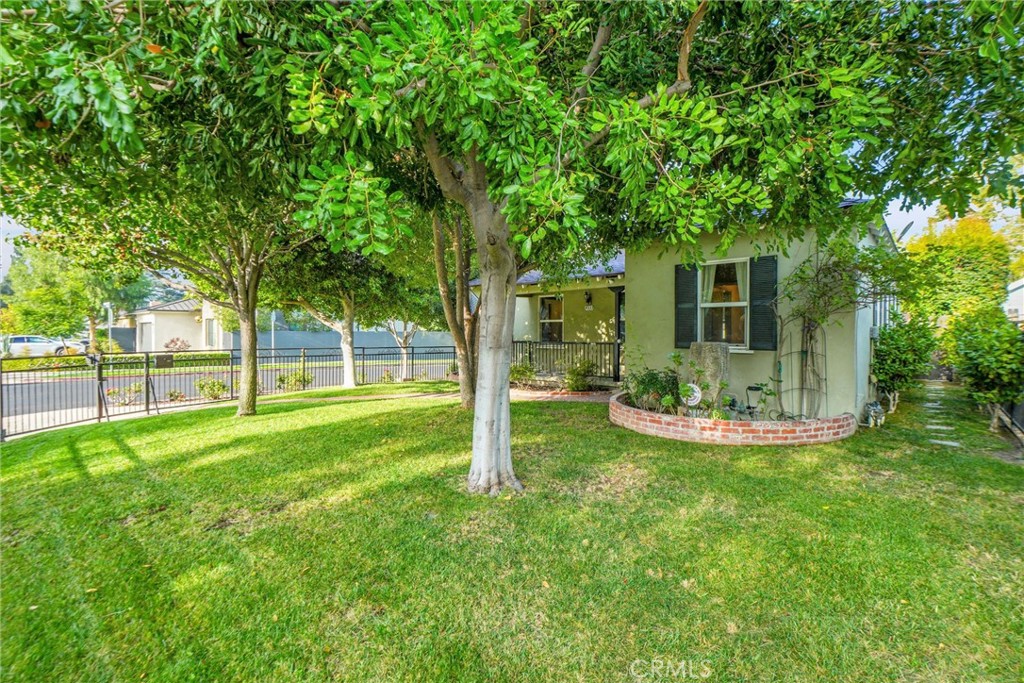 Welcome to this charming 2-bedroom, 1-bathroom home situated on a prime corner lot in desirable Studio City. With 1,006 square feet of living space on an expansive 6,674 square foot lot, this property offers both comfortable living and excellent future potential.
The well-designed floor plan features a bright living room that opens to two generously sized bedrooms, with a full bathroom centrally located for convenience. The living area flows seamlessly into a formal dining space, creating an open feel perfect for everyday living and entertaining.
The functional kitchen comes well-equipped with a 4-burner gas range, stainless steel refrigerator, microwave, dishwasher, and brand new wine cooler.
A cozy den with fireplace provides additional living space perfect for relaxation or recreational activities. The property includes a valuable bonus feature—a separate studio unit in the backyard with its own bathroom, offering versatile options for a home office, or guest accommodations.
The property is secured by an electric front gate and features a spacious front yard with endless possibilities for landscaping or outdoor enjoyment.
Built in 1940, this home combines vintage charm with modern amenities. The coveted Studio City location provides convenient access to trendy Ventura Boulevard shopping and dining, plus highly-rated local schools. This unique property presents an excellent opportunity for investors, developers, or buyers seeking a home with expansion possibilities in one of the Valley's most sought-after neighborhoods.