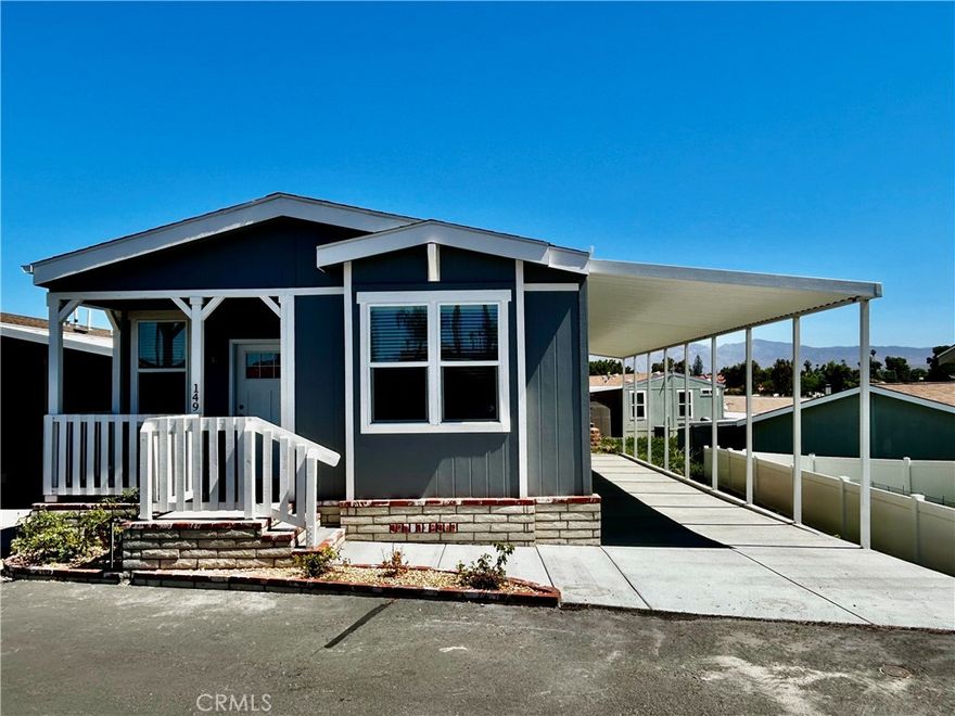 Beautiful brand-new 3-bedroom, 2-bath mobile home located in Hemet’s award-winning #1 all-ages family park (2024). This home features an open floor plan with a spacious kitchen, large center island, and walk-in pantry—perfect for entertaining and everyday living. The kitchen opens seamlessly to the living room, creating a bright and inviting space. Ceiling fans are installed throughout the home for added comfort. Exterior features include a storage shed, a large carport accommodating 2–3 vehicles, and a charming front porch ideal for enjoying stunning sunset views. Ideally situated directly across from the community pool and park. Don’t miss this opportunity—schedule your private showing today!