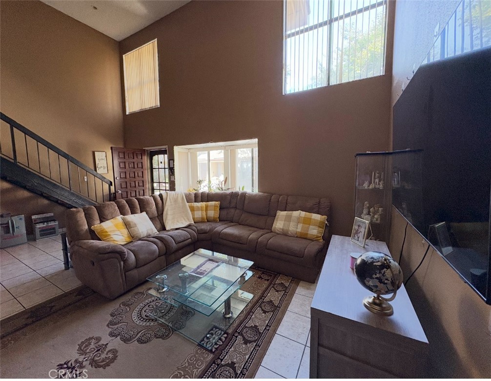 Welcome to this charming 2 bedroom, 2 bath townhome — ideal for first-time buyers or anyone looking to downsize without sacrificing comfort. As you enter, you’ll notice the natural light and high ceilings that create an open, airy feel in the living area. The kitchen includes space for a cozy breakfast nook and opens to the backyard patio, perfect for BBQs or relaxing outdoors. A convenient downstairs bedroom also has access to the patio and connects directly to the attached 2-car garage for easy entry and exit. Upstairs, you’ll find a spacious primary suite with recessed lighting, ceiling fan, and a walk-in closet. The community offers two pools for summer enjoyment and is located near excellent dining, shopping, schools, and freeway access. Come see all this home has to offer!