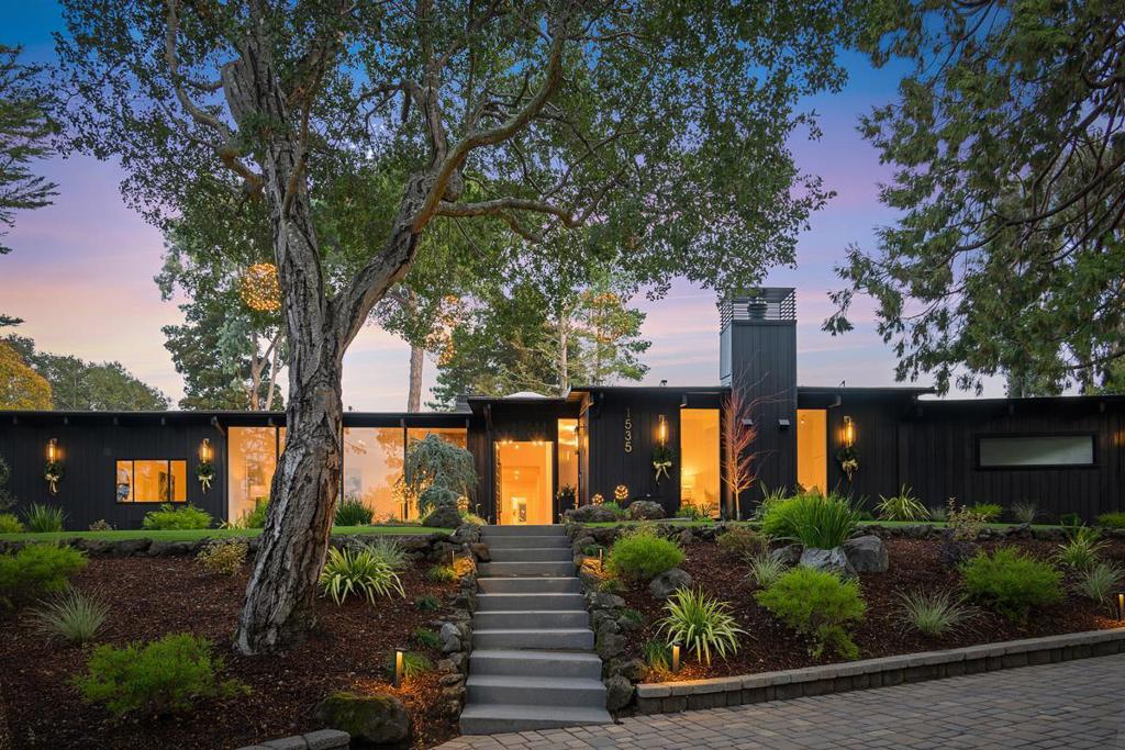 This mid-century modern gem welcomes you with new wood flooring, vaulted beamed ceilings and an open floor plan with many skylights and floor-to-ceiling windows. The living room provides a stunning view of the lush and verdant front yard and features a stone fireplace. The formal dining room has direct access to the back patio and verdant yard. The remodeled kitchen features top-of-the-line appliances, ample counter space, an open breakfast area, and custom built-in cabinets. The casual living room features a fireplace and provides access to the patio and the carport. The primary en-suite has an expansive walk-in closet, an attached office area, a brand-new spa bathroom with a marble vanity, designer lighting and mirrors, and heated floors. The three additional bedrooms offer ample storage and are adjacent to two remodeled bathrooms. The backyard has multiple patios and seating areas, grand perimeter trees, new landscaping, and a sparkling pool. This property offers privacy, spacious land, an assemblage of custom-built and remodeled residences, award winning private and public schools, easy access to Highway 280 and close proximity to San Francisco International Airport, Silicon Valley, the booming Biotech Industry, and to a variety of walking trails, parks and golf courses.