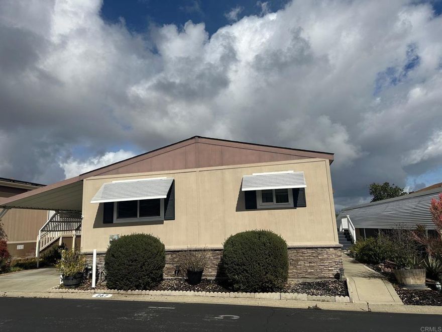 Welcome to your dream retirement home! Situated in 5-star, 55+ community of Rancho Escondido, where you own the land! This beautiful home has so much to boast about!! As you enter, you are welcomed into a great room that incl. a large living room, kitchen w/large island seating & dining area. From every window in this great room, inc. a sliding glass door to a huge rear Trex deck, there are incredible views to soak in. The home itself shows real pride of ownership, Hardiboard siding, as well as, built to match shed. Vaulted ceiling down center of the home, neutral paint colors, crisp white 3-panel doors, inc. closets. All bedrooms w/carpet, the rest of the home has upgraded neutral laminate plank floors. Wonderful kitchen...large pantry & island have pull-out shelves. Recessed lighting & pendant lighting over island. Granite counters thruout. Large primary suite  & bath w/separate room for toilet, built in linen & full shower.  3-car carport.