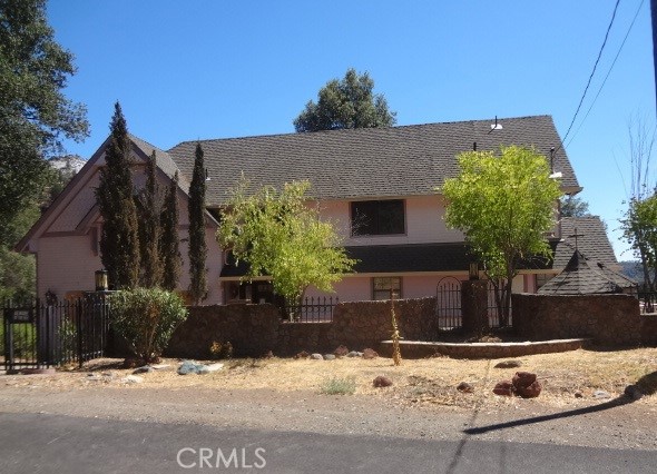 This Homepath property has that look of an old Victorian home with an abundance of rooms that will house a large family. The 3 story home features a sunken living room with 2 story ceiling, fireplace and balcony above; sitting next to the living room is the dining area and kitchen. From there it has 6 bedrooms and 5 baths; a room at the front entry has a closet and could be a 7th bedroom if desired! And let's not forget the bonus rooms in the attic including the 5th bath. Home does need some work but has so much to offer! Deck wraps around almost 3/4 of the house. County records show 1784 sq ft on the home but home is much larger and appears to be over 4,000 sq ft. Lot is almost 1/2 acre shown at 18,295 sq ft. Outbuilding. Bring the kids and grandkids---