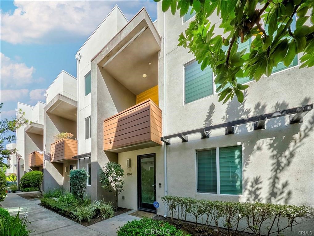 Welcome to this stunning tri-level modern condominium located in the highly desirable Parker Collection community in Buena Park. Built in 2016, this home offers 2 spacious bedrooms, 2.5 bathrooms, and a versatile den/office on the first floor that can also be used as a third bedroom or flex space.
The home features an open-concept floor plan with a bright living area seamlessly connected to a spacious balcony—perfect for relaxation or entertaining. The modern kitchen offers ample cabinetry and counter space, complemented by recessed lighting and beautiful laminate wood flooring throughout the entire home. Upstairs, you’ll find two private bedrooms, each with its own en-suite bathroom and walk-in closet, providing ultimate comfort and privacy. The laundry area is conveniently located with a washer and dryer included. This eco-friendly home is equipped with paid-off solar panels, a Nest thermostat, and an Energy Star-rated hybrid electric water heater for exceptional energy efficiency. The attached 2-car garage provides direct access and comes complete with a Tesla EV charging station. Residents of The Parker Collection enjoy resort-style amenities, including a swimming pool, spa, cabanas, BBQ area, dog park, playground, and beautifully landscaped community spaces. Ideally located near The Source Mall, Buena Park Downtown, Knott’s Berry Farm, and Disneyland, this property also offers easy freeway access to the 91 and 5, making commuting and weekend adventures a breeze. Don’t miss this rare opportunity to lease a beautiful, move-in-ready home in one of Buena Park’s most sought-after communities — The Parker Collection.