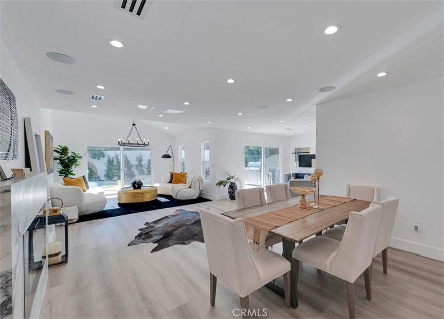Nestled in a quiet cul-de-sac in one of Encino’s most desirable neighborhoods, this beautifully remodeled and expanded residence offers 3 bedrooms, 3.5 bathrooms at 2,100 sqft. The main home features a spacious open layout with seamless flow from the living room to the dining area and chef’s kitchen, complete with top-of-the-line appliances and a fireplace overlooking the entertaining space. A laundry room with a stackable washer/dryer and ample storage sits just off the kitchen. The primary suite overlooks the pool and includes a custom walk-in closet and spa-like bathroom with dual sinks and elegant finishes. Two additional bedrooms and bathrooms complete the main house. Sleek doors open to the manicured backyard, where a sparkling pool, outdoor seating area, and BBQ provide the perfect setting for indoor-outdoor living. Pool and gardener maintenance are included in the lease. Additional highlights include internal and external security cameras, a Ring system with a panic button, and the option for a backyard shed for extra storage. Located in the sought-after Hesby Oaks Charter School district, with easy access to freeways, local parks, and Ventura Boulevard’s shops and restaurants.