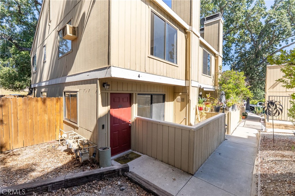 Welcome to Village Oaks in Atascadero! This inviting 2 bedroom, 1.5 bathroom condo has been recently updated with new flooring and fresh finishes, making it move-in ready. A rare highlight is the oversized private backyard, perfect for entertaining, gardening, or relaxing under the oak trees. The living room features a cozy wood-burning fireplace, while the kitchen and dining area open to the spacious outdoor retreat. Upstairs you will find two comfortable bedrooms, a full bath, and a convenient laundry area, with a guest half bath on the main level. A detached single-car garage and a reserved parking space, community pool, and low-maintenance lifestyle add to the appeal. Ideally located just minutes from vibrant downtown Atascadero, parks, shopping, and a short drive to the coast, Paso Robles Wine Country, and San Luis Obispo, this is Central Coast living at its best!