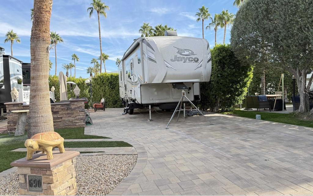 Lot 690, Fully improved with pavers and stacked stone, this east to west lot has remarkable Mountain Views, high hedges providing good privacy, and golf-cart parking. A minutes walk to El Saguaro clubhouse and the start shack. Outdoor Resort Palm Springs (ORPS) is a Guard Gated 5-Star RV Resort Community offering an active and luxurious lifestyle featuring golf (27 holes), tennis, pickleball, swimming and more! Two clubhouses, fitness center, beauty solan, La Roma Restaurant on campus, dog park and more!