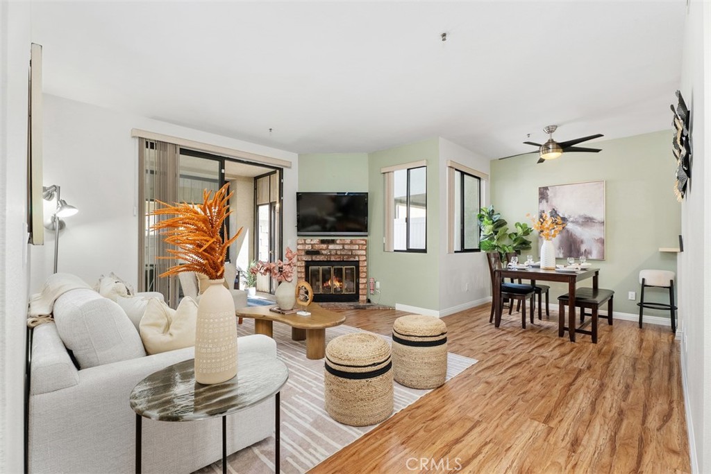Welcome to this beautifully updated 2 Bedroom 2 Bathroom single level condo. Featuring 2 Master Suites, each with its own full bathroom and walk-in closet. One bathroom includes a tub with shower, while the other has a walk-in shower for added versatility. Enjoy the open living space with high ceilings, a fireplace in the living room, and laminate wood-like flooring that brings warmth throughout. The upgraded kitchen offers plenty of storage, modern finishes, and is paired with the convenience of an in-unit stackable washer and dryer located in the kitchen closet. Parking is convenient with a 1-car detached garage, an additional assigned space, plus ample guest parking. This home is move-in ready and offers the perfect blend of style and function in a desirable location, near the beach, trendy restaurants, and local grocery stores, you’ll have everything you need just minutes away.