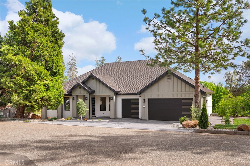 Welcome to this west-side Paradise gem—where quality upgrades and location truly shine. This home boasts a 50-year presidential roof, a custom-engineered deck railing and staircase leading to an expansive concrete patio, plus extensive hardscaping and a secondary driveway that add both beauty and function. The wide property also offers plenty of room for a future shop or ADU, along with valuable under-house storage. Nestled in one of Paradise’s most sought-after established neighborhoods of custom homes with stunning sunset and distant valley views, the setting is as impressive as the home itself. Inside, you’ll find thoughtful details throughout—a custom kitchen with white oak cabinetry, fluted wood accents, quartz countertops, and upgraded tile backsplash, plus a striking living room built-in beneath a tall box-beamed ceiling. Every space was designed with both comfort and craftsmanship in mind, creating a timeless style that feels elegant yet inviting. With its ideal location, usable outdoor spaces, and premium finishes, this property perfectly blends practicality with beauty—an opportunity not to be missed.