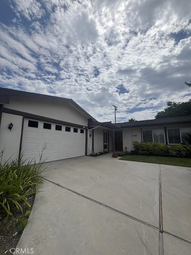 This 3 bedroom 2.5 bath home is totally remodeled inside. Beautiful flooring throughout the house. Brand new self closing kitchen cabinets and drawers and brand new Corian counters. New appliances; stove and dishwasher. Beautiful kitchen sink. Spacious island with seating area ready to entertain family and guests. Wine cooler with wine racks above. Washer and dryer hookups. Multi colored electric fireplace in the living room. Family room has two skylights that brightens up the room. Main bathroom has a bathtub. Master bathroom has a walk in shower and double vanity. Master bedroom has a walk in closet. Access to the backyard from the master bedroom. Spacious backyard with in ground hot tub. House is in a beautiful and quiet neighborhood. Walking distance from an elementary school.