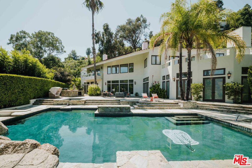 Welcome to Anzio Estate, an opulent 8-bedroom, 10-bathroom sanctuary sprawled across 2.59 acres in the heart of lower Bel Air. As you ascend the private, dual-gated drive, you'll be greeted by panoramic canyon views and unparalleled luxury. This 10,370-square-foot masterpiece is perfect for families, friends, or business colleagues seeking an extraordinary stay.The estate boasts world-class amenities, including a professionally lit tennis court, a billiards room, a state-of-the-art theater, a bar, a wine cellar, and a personal gym complete with a sauna. Outdoors, an inviting barbecue area offers al fresco dining with a stunning backdrop, while the master retreat provides a serene sanctuary.Anzio Estate is a celebration of life's grandeur, offering a seamless blend of elegance and entertainment. It's the ideal home away from home for discerning travelers seeking the ultimate in luxury.
