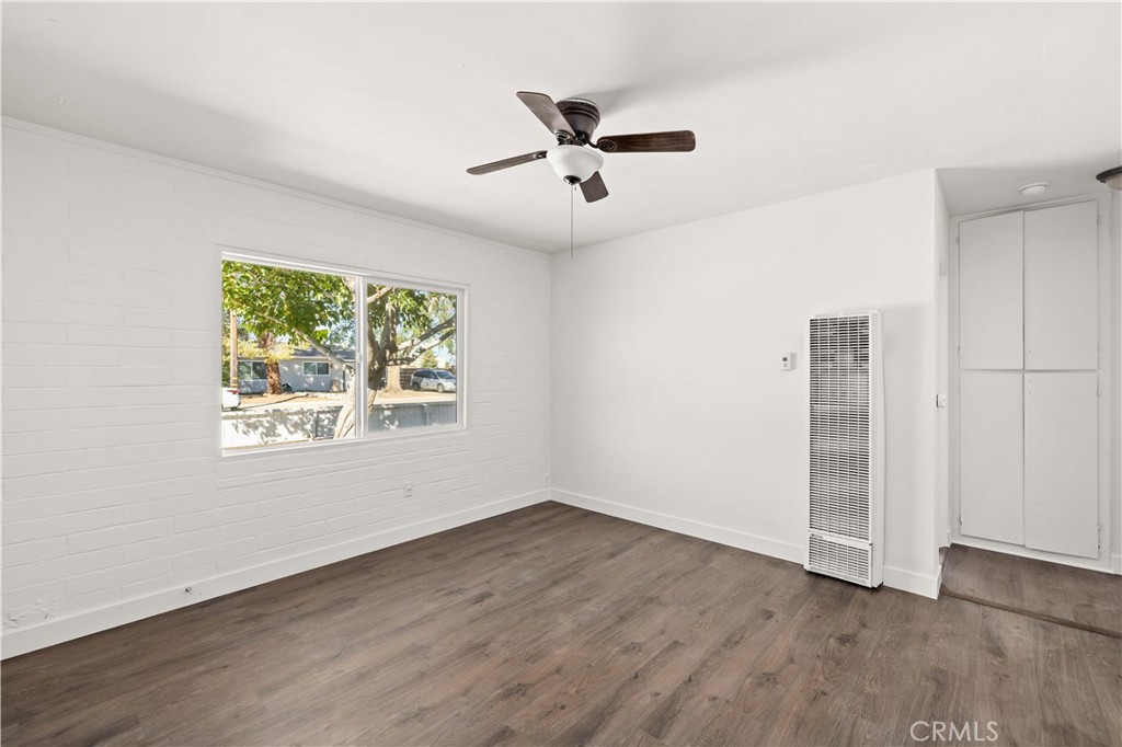 This updated duplex features two units, each offering one bedroom, one bathroom, and a kitchen. Recent improvements include a brand-new roof installed just three months ago, fresh interior paint throughout, new laminate flooring, and new fencing for added privacy. Situated on a spacious 8,800 sq. ft. lot, the property offers separate backyards for each unit as well as convenient drive-in access from the rear. Ideally located near schools, shopping, dining, and just a few miles from the 14 Freeway (for commuters), this home offers excellent potential for investors seeking rental income or families looking for multigenerational living. Don't miss your opportunity to view this move-in ready duplex before it's gone!