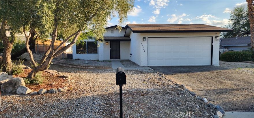 Lovely 4 bedroom 2 bath home in the Cornerstone community of north Desert Hot Springs. Recently updated with modern white shaker cabinets, vinyl flooring, led lights, new paint inside and outside, New energy efficient windows. As you enter the home you will find a large living room with loads of natural light great for entertaining. The dining area is to your right and leads into the kitchen. The slider in the kitchen opens into the side yard perfect for enjoying dining al fresco. From the living room, the hallway guides you to three guest bedrooms and the main bedroom. All four bedrooms have plenty of closet space, ample room for all your treasures. The home has two bathrooms, the guest bathroom down the hallway on the right and a private ensuite bathroom off the primary bedroom. The home has a newer central air conditioner and forced air heating. Up the concrete drive there is a 2 car garage with abundant room for storage and the side yard has RV access potential. The home has a fully fenced yard accessed through the garage or the gates on either side of the home with an added fenced area in the back, perfect for keeping pets separate from the side yard. The property is clean and graded ready for your personal landscaping touch. The property is less than two miles from the shops & services in downtown Desert Hot Springs and just 13 miles to the vibrant world of Palm Springs. Come call this property home.