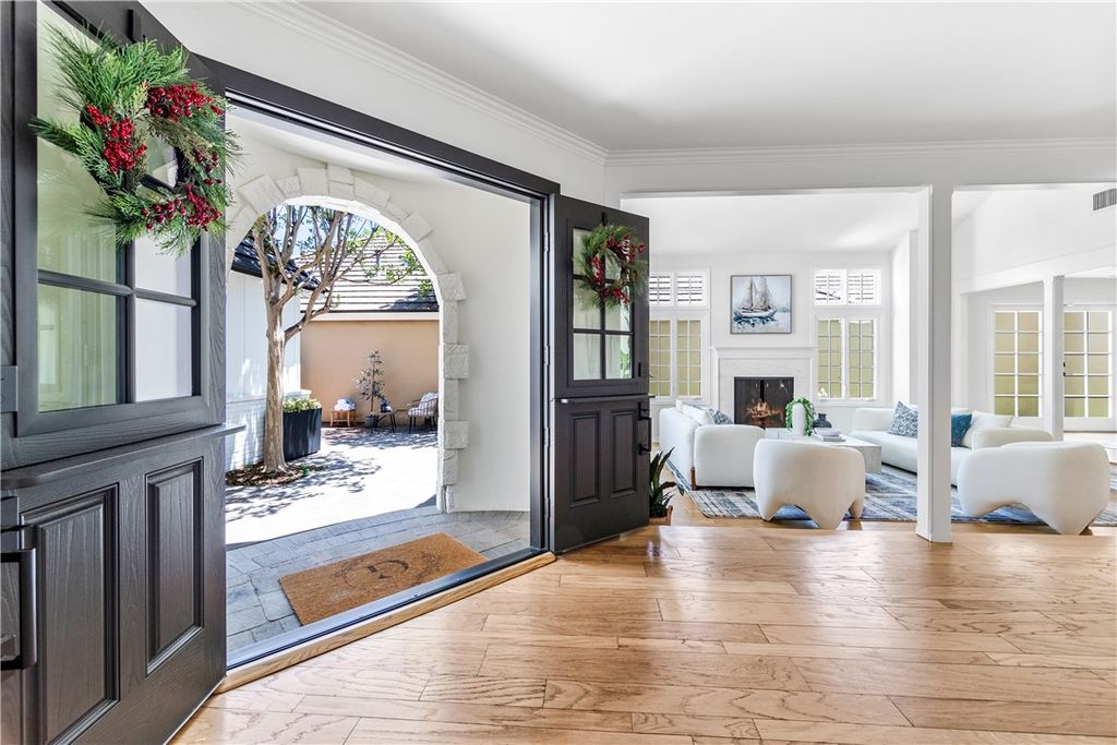 Photo of 19365 Woodlands Drive, Huntington Beach, CA 92648 (MLS # OC25239384)